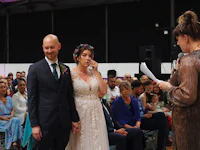 a bride and groom are crying during their wedding ceremony