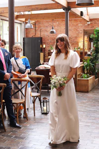 a bride walks down the aisle at a wedding