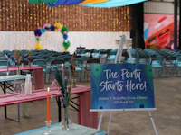 a sign that says the party starts here