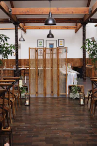 a room with wooden tables and chairs